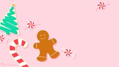 a pink background with candy canes and a gingerbread man on the left side