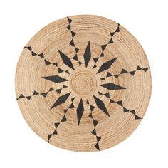 a round rug with black triangles on it