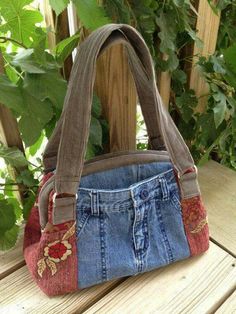 a purse made out of old jeans and fabric