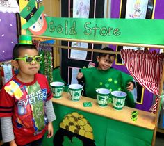 two young boys wearing st patrick's day hats and green shirts at a store