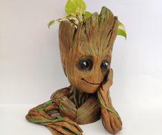 a baby groote planter sitting on top of a table