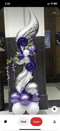 balloon sculpture with purple and silver decorations