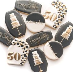 decorated birthday cookies arranged in the shape of 50ths and fiftyth anniversary cake slices