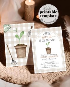 two cards with plants on them are sitting on a wicker basket next to candles