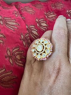 This gorgeous Kundan ring will add a perfect charm to your festive wear. One of our favourite picks for the wedding season  Size Adjustable  Pink beads border Notice the zirconia stones bordering the center Kundan piece. Premium Quality Indian Kundan Jewellery, Kundan Rings, Kundan Ring, Indian Ring, Elephant Bangle, Ring Indian, Indian Rings, Stone Necklace Set, Vintage Elephant