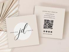 two business cards sitting next to each other on top of a white surface with the word fil printed on it