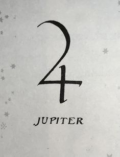 the number two is written in black on a white paper with stars and snowflakes