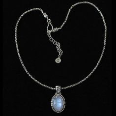 Oval Balinese Moonstone Necklace delicately designed with spirals decorating the side and a Balinese Om symbol on the bail.• Handcrafted in the finest .925 Sterling Silver.• Handmade textured Triple Chain which adjusts 16"-18" with a hook clasp & logo tag.• From the Mystic Moon Collection, featuring high quality Rainbow Moonstones from India, to enhance your intuition, provide protection & attract love.• 1- 18x13mm Rainbow Moonstone.• Height of pendant from top of bail: 1 3/8″.• Designed Elegant Engraved Moonstone Jewelry, Elegant Moonstone Jewelry With Oxidized Finish, Elegant Oxidized Moonstone Jewelry, Crescent Moon Necklace Silver, Om Necklace, Mystic Moon, Lotus Earrings, Attract Love, Rainbow Moonstone Necklace