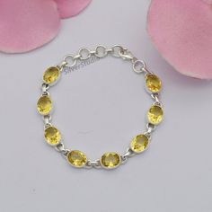 Natural Citrine Bracelet, 925 Sterling Silver Citrine Bracelet, Handmade Silver Gemstone Bracelet, Solid Silver Bracelet. Metal:- 925 Sterling Silver Gemstone:- Citrine Stone Shape:- Oval Stone Size:- 8x10MM Bracelet Length:- 8 inch including 4 extenders. The Bracelet is stamped 925. About Gemstone:- Citrine is a natural, yellow to golden brown colored, semi-precious gemstone from the Quartz mineral family. According to the Vedic astrology, this gemstone is worn as the substitute (upratna) of pr Yellow Sterling Silver Bracelet, Solid Silver Bracelets, Quartz Mineral, Hand Cuff Bracelet, Citrine Bracelet, Bracelet Metal, Vedic Astrology, Women Bracelet, Citrine Stone