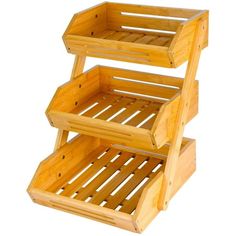 three wooden shelves stacked on top of each other with one shelf holding two trays