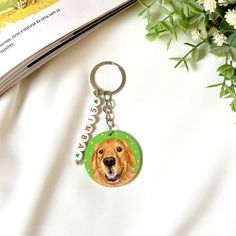 a dog keychain with a photo of a golden retriever on it