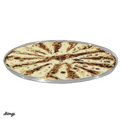 an oval serving tray with tortilla shells on the bottom and silver trimmings