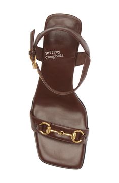 A classic, goldtone horsebit accents the slender vamp strap of this sandal lofted by a sturdy block heel. 3 1/2" heel (size 8.5) Leather upper/leather and synthetic lining/synthetic sole Imported Fall 2024 Shoes Women, Unique Womens Shoes, Brown Heel Sandals, Brown Shoes Women, Brown Sandals Outfit, Affordable Heels, Going Out Shoes, Summer Sandals Heels, Bar Shoes