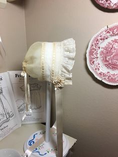 6 9 Mo.ecru Organdy and Lace Baby Bonnet With Ruffle. - Etsy Fitted Cotton Cream Bonnet, Fitted Cream Bonnet With Lace Trim, White Fitted Vintage Bonnet, Lace Baby Bonnet, Ribbon Rosettes, Heirloom Dresses, First Communion Dresses, Baby Bonnets, Albany Ny