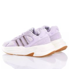 Adidas Ozelle Lilac Swarovski is the custom women's sneaker sporty and glamorous. The three iconic Adidas stripes dress up with Swarovski crystals matching the upper. It's the details that make the difference and these sneakers are proof of that. Sporty Low-top Rhinestone Sneakers, Sporty Low-top Sneakers With Rhinestones, Luxury Embellished Sneakers For Streetwear, Sporty Embellished Lace-up Sneakers, Sporty Low-top Embellished Sneakers, Sporty Embellished Low-top Sneakers, Crystal Embellished Lace-up Sneakers For Streetwear, Low-top Crystal Embellished Sneakers For Streetwear, Crystal Embellished Low-top Sneakers For Streetwear