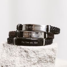 This elegant engraved bracelet for men is a stylish accessory that shows your personal touch making it one of a kind. We will engrave any name or phrase with a special meaning of your choice. This bracelet is perfect for any man, whether it's for a special occasion such as valentines day or an anniversary as a meaningful gift for a loved one. 💬 Please send us your engraving text via direct messages. 📣 Additional information about the product 👉 Material: Stainless steel 👉 Finish: Silver, Coffee, Black 🎁 Comes with a gift box Elegant Black Engraved Name Bracelet, Black Engraved Name Bracelet For Gift, Engraved Black Name Bracelet For Gift, Personalized Stainless Steel Bracelets For Father's Day, Father's Day Engraved Stainless Steel Bracelets, Father's Day Stainless Steel Engraved Bracelets, Father's Day Engraved Stainless Steel Wristband, Father's Day Stainless Steel Engraved Wristband, Black Bracelets With Engraving Option