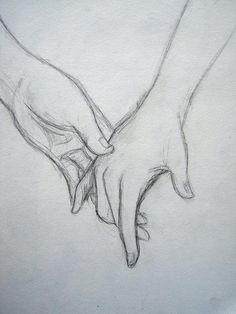 two hands holding each other in the shape of a heart on a sheet of paper