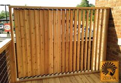 a wooden fence on the side of a building