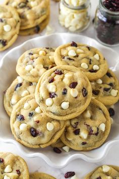 cookies with white chocolate chips and cranberries on a plate