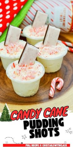 candy cane pudding shots on a wooden plate