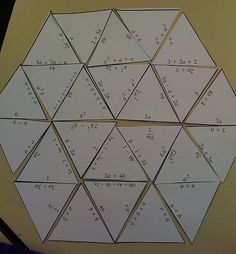 several pieces of paper are arranged in the shape of a hexagonal pentagon with numbers on them