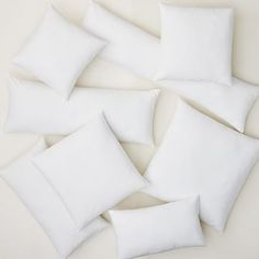 six white pillows arranged on top of each other