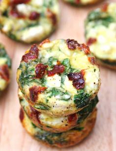 mini frittatas with spinach, bacon and cheese are stacked on top of each other