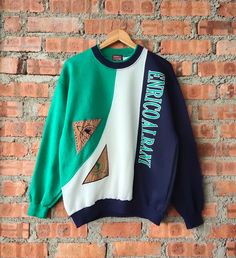 Vintage 90s Enrico Italy Sweatshirt Italy Crewneck Italy Pullover Italy Jumper Embroidery Patch Blue, Green, White Color Men's L Label : Enrico Albani Italy Label Size : L (refer the measurement) Made in China Materials from 100% Cotton  Used Item With Condition 8/10 Refer Picture. Stain and No Holes. Lay Down Flat Measurement : - Width (armpit to armpit) and: 23.5 Inches - Length (shoulder to end of garment): 27 Inches We are selling used clothing with good condition. DO NOT EXPECT the item is College Crew Neck Patchwork Sweatshirt, Vintage Patchwork Tops For Streetwear, Retro Patchwork Sweatshirt For Streetwear, Vintage Crew Neck Patchwork Sweatshirt, Vintage Crew Neck Sweatshirt With Patchwork, Vintage Crew Neck Patchwork Tops, Vintage Embroidered Sweatshirt For Streetwear, Retro Embroidered Crew Neck Sweater, Vintage Patchwork Crew Neck Top