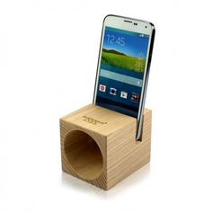 a cell phone sitting on top of a wooden stand