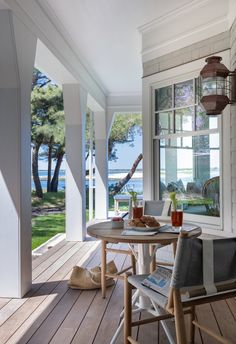 an image of a porch with chairs and table