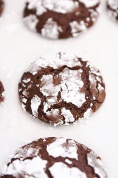 chocolate crinkle cookies with powdered sugar on top are ready to be eaten