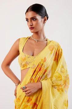 Yellow saree featuring a pure georgette base detailed with mellow bloom hand paint and zari embroidery on the pallu. Paired with a matching hand painted striped chanderi blouse. - Aza Fashions Summer Georgette Blouse Piece, Dhoti Saree, Cotton Sarees Handloom, Zari Embroidery, Hand Painted Sarees, Yellow Saree, Lehenga Saree, Blouse For Women, Stripe Silk