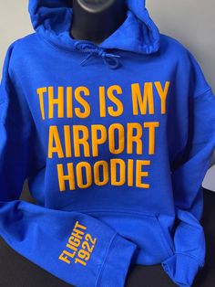 "ntroducing the perfect companion for your travels - the \"This Is My Airport Hoodie\". Upgrade your travel wardrobe and make a statement wherever you go with the \"This Is My Airport Hoodie\". Order yours today and embark on your next adventure in style. Features: Premium quality Blue Hoodie Unisex Bold Gold 3D Puff \"This Is My Airport Hoodie\" Comfortable and soft fabric Versatile design for travel or casual wear Cozy hood for extra warmth Available in multiple sizes for the perfect fit" Sigma Gamma Rho Paraphernalia, Sigma Gamma Rho Photoshoot, Sigma Gamma Rho Shirts, Sigma Gamma Rho Pillow Ideas, Sigmaversary Sigma Gamma Rho, Rho Gamma, Sigma Gamma Rho Coats & Jackets, Sigma Gamma Rho Sorority, Delta Sigma Theta Gifts