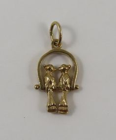 "This is a vintage mechanical \"Love Birds\" 10 karat gold charm for a charm bracelet. Each bird is movable on the ring. It weighs 1.75 grams and measures 1/2\" x 3/4\", marked \"10K\" All charms come with a split ring to attach to a bracelet. We have hundreds of charms in stock. If you don't see what you are looking for in our shop please contact us as it is likely we have it. Inventory #G5203" Victorian Yellow Gold Charms For Gift, Victorian Yellow Gold Charms For Gifts, Vintage 14k Gold Engraved Charms, Vintage Engraved 14k Gold Charms, Vintage 14k Gold Charms For Gift, Vintage 14k Gold Pendant Charms, Antique Yellow Gold Brass Charms, Vintage Gold Charms Stamped 14k, Vintage Yellow Gold Charms For Anniversary