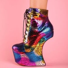 Elevate your style with these statement-making multicolor snake embossed lace-up wedge platform ankle boots. Combining trendsetting design with all-day comfort, these boots are a must-have for fashion-forward individuals. Color: Multicolor Heel Type: Wedge heel Heel height: 5.5" / 140 mm approx Product measurements were taken using size 8. Please note that measurements may vary by size. Toe: Round toe With platform lace-up design Handcrafted US sizing. Fits true to size. Party Platform Ankle Wedge Boots, Platform Ankle Wedge Boots For Party, Multicolor Platform Lace-up Heels, Multicolor High Heel Platform Boots For Party, Multicolor Platform Boots For Parties, Multicolor High Ankle Party Boots, Multicolor Round Toe Platform Boots For Party, Platform Wedge Heel Boots For Party, Multicolor High-top Platform Boots