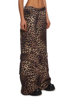 These pants have a stretchy twill construction with an all-over leopard print, a wide leg, cargo pockets on the legs with snap button closures, front and back pockets, and a front button and zipper closure. Dolls Kill Outfits, Wide Leg Cargo Pants, Y2k Fashion, Dolls Kill, Exclusive Collection, Tank Dress, Snap Button, Cargo Pants, Online Boutique