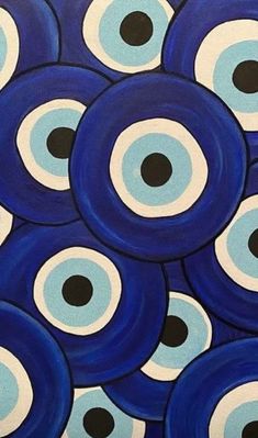 an image of blue and black circles painted on canvas