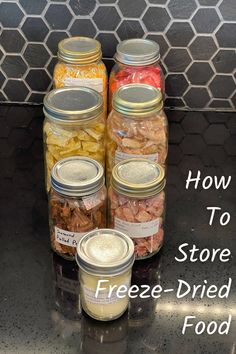 four jars filled with food sitting on top of a counter next to the words how to store freeze - dried food