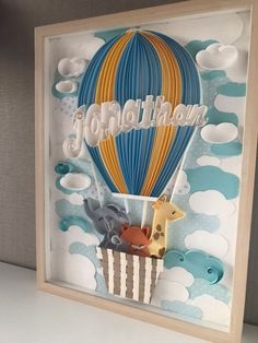 an origami hot air balloon with animals in it