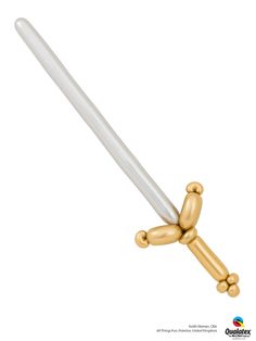 an object made out of gold and white plastic with a large metal tube attached to it