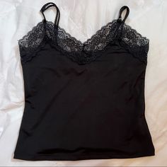 Perfect Condition, Never Worn. Slim Fitting Crop Top. Material Is Spandex So It Stretches. Feels Smooth. Comes With Adjustable Straps! Thick Lace Trim On Top. Ask Any Questions! 95% Polyester, 5% Spandex Elastane Camisole With Built-in Bra For Night Out, Party Elastane Camisole Tops, Elastane Spaghetti Strap Top For Night Out, Spaghetti Strap Top For Night Out, Elastane Cami Top For Night Out, Stretch Trendy Camisole For Night Out, Stretch Elastane Camisole For Night Out, Black Elastane Tank Top For Night Out, Night Out Elastane Camisole With Built-in Bra