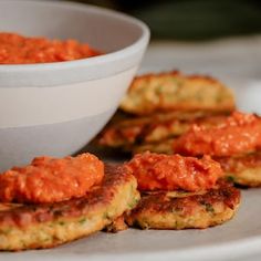 some food that is on a plate near a bowl