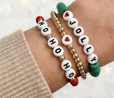 two bracelets that say holiday on them