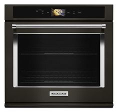 an oven with the door open and its light on, in black stainless steel finish