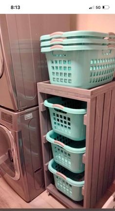 a washer and dryer stacked on top of each other in a laundry room