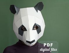 Make your lovely Panda mask, using your home printer and this pdf pattern. This low poly mask is quite easy to make and there is a video tutorial to make this even easier! Personalize your papercraft mask with different paper colors, and ornaments and make the best panda bear costume ever!  This papercraft mask is designed to fit the average adult's head. But if you print it on an 85-90% scale, it will be great for KIDS!  VIDEO TUTORIAL  --- > Here you will find an assembling video tutorial: htt Panda Mask Diy, Panda Bear Costume, Papercraft Mask, Diy Halloween Masks, Paper Face Mask, Panda Mask, Panda 3d, Low Poly Mask, Masks Design