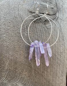 Raw purple quartz crystal points in gold or silver hoop earrings with French hooks. Perfect little boho look. Light weight and easy to wear. Add these to your boho outfits and make a 💜Healing clear quartz Crystal property has been know for centuries to restore balance in the body. -Options- 30mm as shown 21 gauge hoops Total drop Length: 2.3 inches 14k Gold filled hoops Sterling silver hoops Gold plated hoops Silver plated hoops All comes with hooks Simple, Dainty, Delicate, yet so Elegant and Handmade Minimalist Dangle Crystal Earrings, Handmade Minimalist Crystal Dangle Earrings, Bohemian Wire Wrapped Hoop Jewelry, Purple Bohemian Everyday Jewelry, Adjustable Gemstone Hoop Jewelry, Purple Dangle Hoop Earrings With Ear Wire, Nickel-free Purple Dangle Hoop Earrings, Purple Dangle Hoop Earrings, Purple Nickel-free Dangle Hoop Earrings