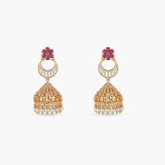 Description The Surabhi jhumki earrings by Tarinika are classic and versatile to style with any ethnic attire. The graceful pearl drops, CZ stones, and gold plating combines beautifully to add radiance to your look. Details & Specifications: Materials used: Brass Alloy with Yellow & White Gold Plating Weight - Earrings: 18.15 gm Length - Earrings: 5 cm Make it custom Want to make it a custom earring? Sure! Reach out to us at support@tarinika.com and we’ll be happy to make possible modifications