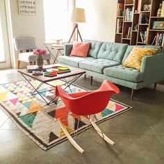 a living room filled with furniture and decor