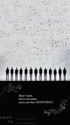 a group of people standing next to each other in front of a sky filled with stars